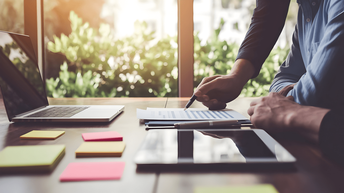 Team planning with laptop in front of two individuals